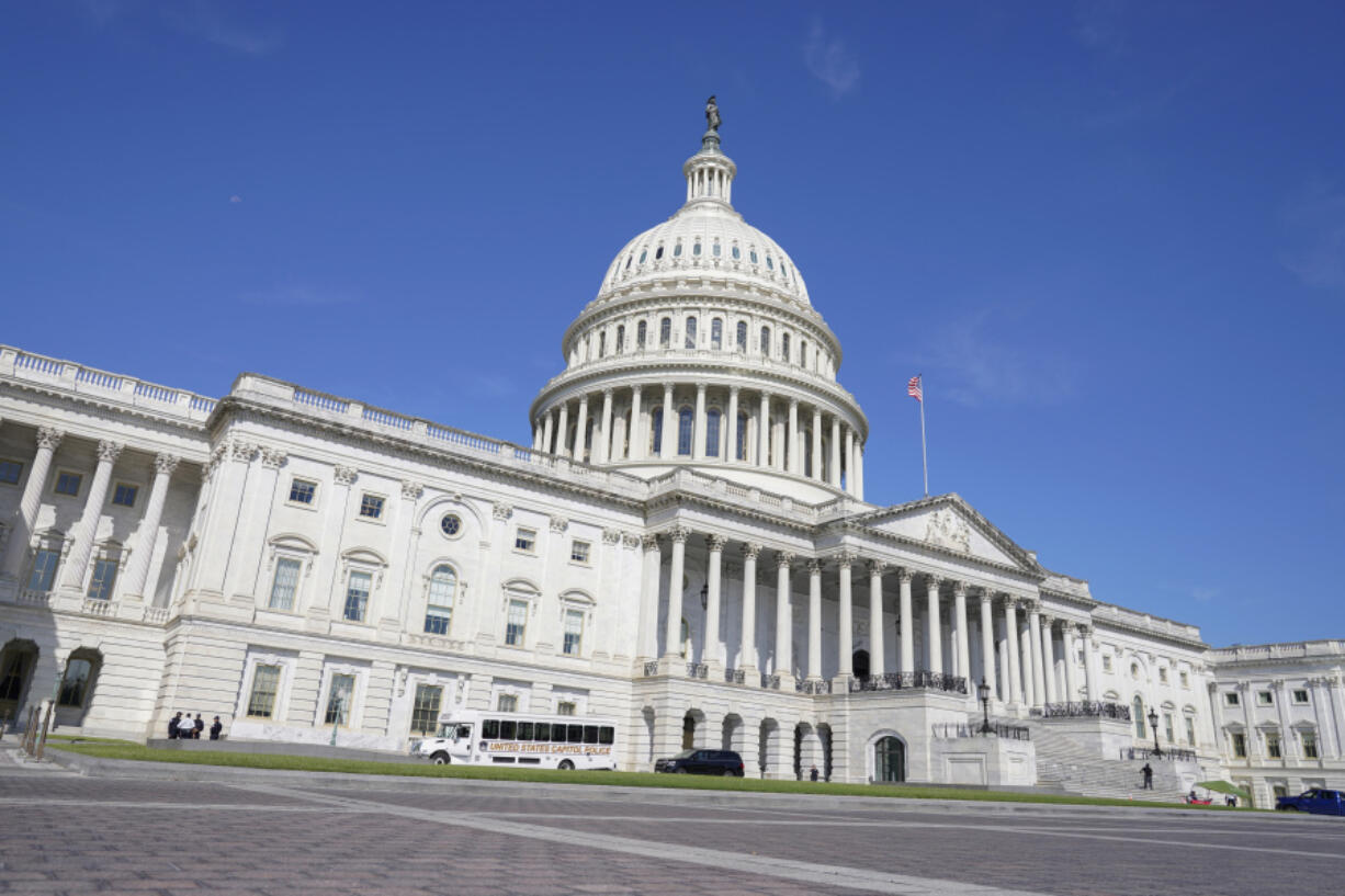 People walk near the U.S Capitol Tuesday, Sept. 5, 2023, in Washington.