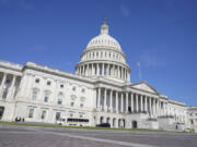 People walk near the U.S Capitol Tuesday, Sept. 5, 2023, in Washington.