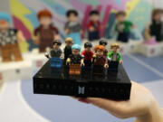 A LEGO set made of its blocks featuring K-pop band BTS, is shown during a March publicity event at a store in Seoul, South Korea.