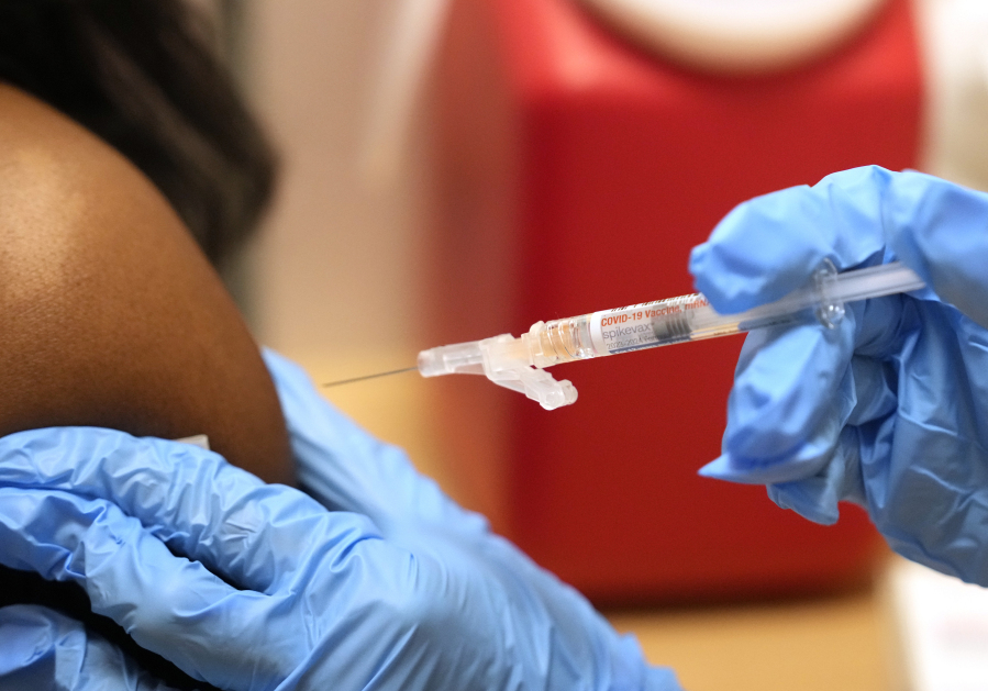 A pharmacist administers a Moderna Spikevax COVID-19 vaccine at a drug store, Wednesday, Sept. 20, 2023, in Cypress, Texas. Fall 2023 vaccination season is in full swing, with health officials in the U.S. urging both an updated COVID-19 shot and flu vaccine for most everyone. New this year are vaccines for older adults and women in late pregnancy to guard against another virus named RSV.