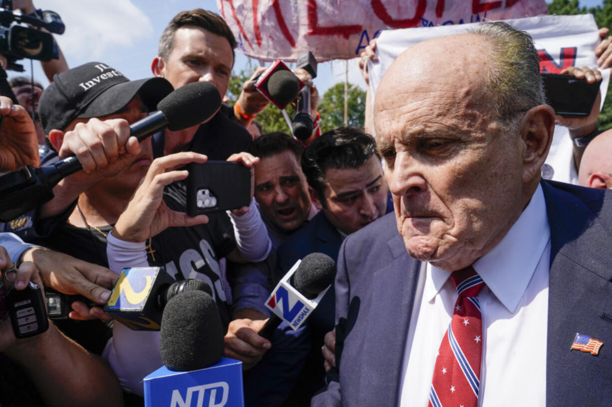 Rudy Giuliani speaks outside the Fulton County jail, Wednesday, Aug. 23, 2023, in Atlanta. Giuliani has surrendered to authorities in Georgia to face an indictment alleging he acted as former President Donald Trump's chief co-conspirator in a plot to subvert the 2020 election.