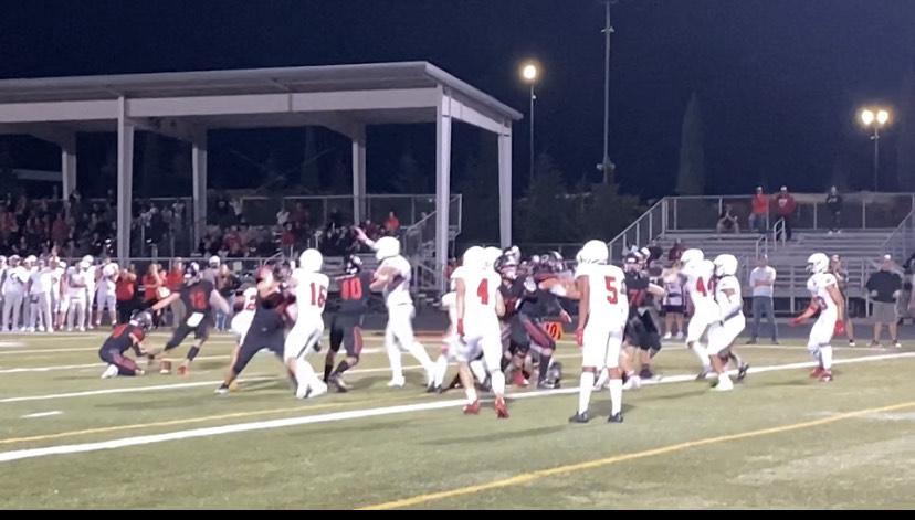 Yelm's Anthony Kiamco (25) blocks Trenton Swanson's potential game-winning field goal in the closing seconds of Friday's game. Yelm beat Camas, 8-7.