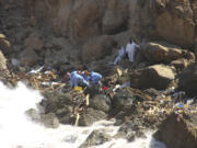 Rescue teams look for flash flood victims in the city of Derna, Libya, Monday, Sept. 18, 2023. Mediterranean storm Daniel caused flooding that overwhelmed two dams, sending a wall of water through the city. More than 10,000 were killed, and another 10,000 are missing.