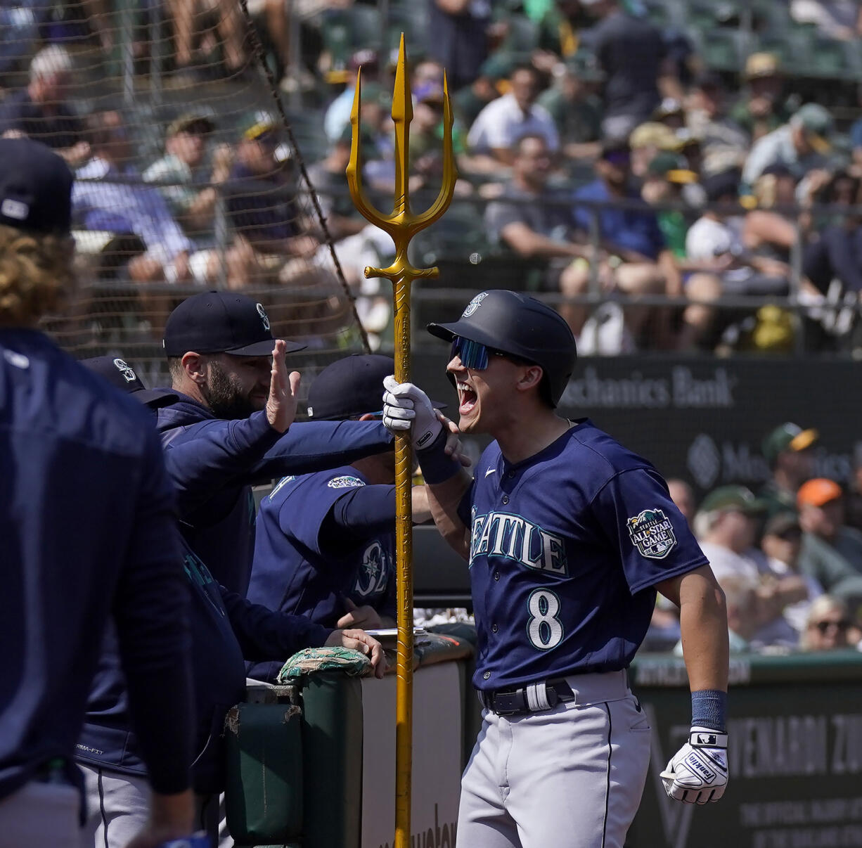 Seattle Mariners' Dominic Canzone (8) celebrates after hitting a two-run home run against the Oakland Athletics during the second inning of a baseball game in Oakland, Calif., Wednesday, Sept. 20, 2023.