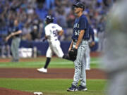 Seattle Mariners starting pitcher George Kirby (68) reacts as Tampa Bay Rays' Rene Pinto (50) runs around the bases after his two-run home run during the seventh inning of a baseball game Friday, Sept. 8, 2023, in St. Petersburg, Fla.