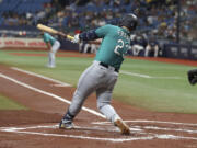 Seattle Mariners' Ty France hits a two-run RBI single against the Tampa Bay Rays during the first inning of a baseball game Saturday, Sept. 9, 2023, in St. Petersburg, Fla.