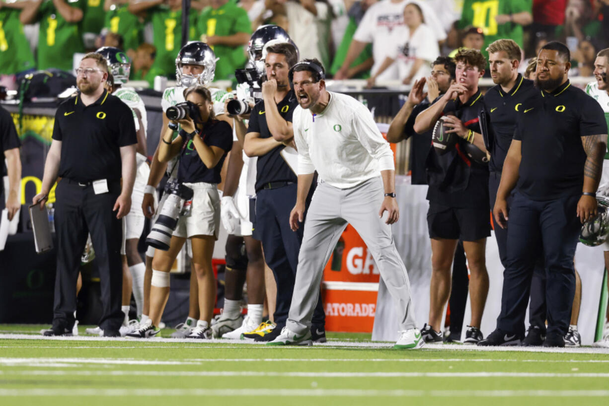 Oregon head coach Dan Lanning shouts to players during the second half half of the team's NCAA college football game against Texas Tech, Saturday, Sept. 9, 2023, in Lubbock, Texas.