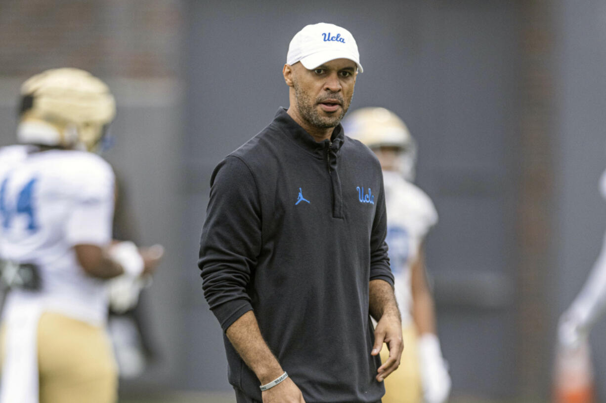 This photo provided by UCLA shows NCAA college football defensive coordinator D'Anton Lynn during practice in Los Angeles Aug. 9, 2023.