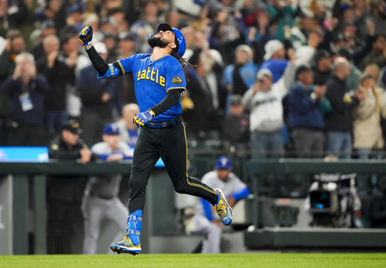 Seattle Mariners' J.P. Crawford heads for home on a grand slam against the Texas Rangers during the fourth inning of a baseball game Friday, Sept. 29, 2023, in Seattle.