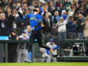 Seattle Mariners' J.P. Crawford heads for home on a grand slam against the Texas Rangers during the fourth inning of a baseball game Friday, Sept. 29, 2023, in Seattle.