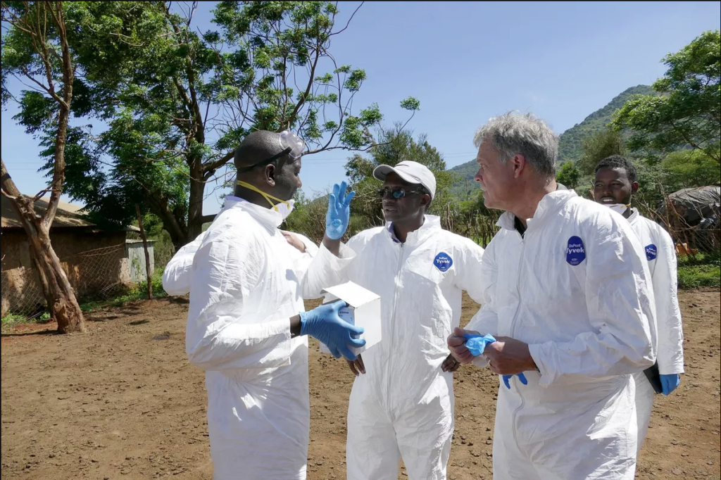 Washington State University’s Kariuki Njenga, center, and Tom Kawula, right, consult with colleagues Arithi Mutembei, left, and Boru Wato, right, as they do field work in Marsabit County in 2018.