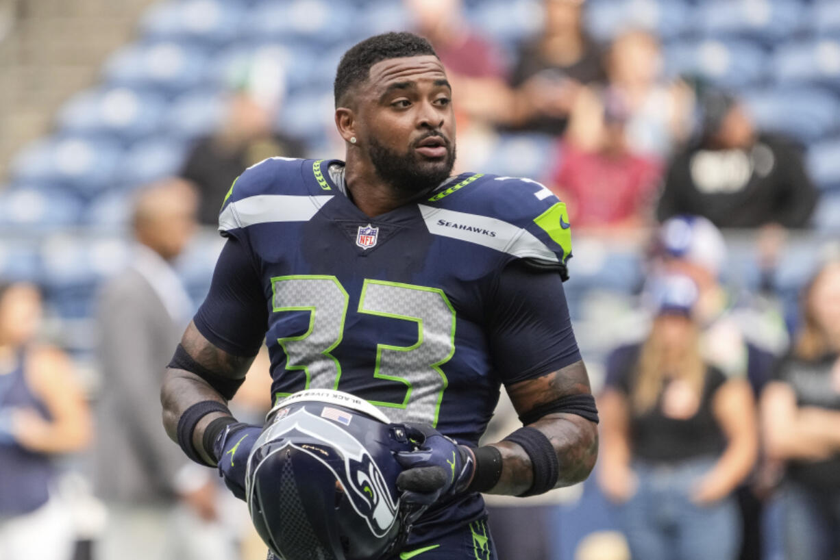 FILE - Seattle Seahawks defensive back Jamal Adams stands on the field before the team's NFL preseason football game against the Chicago Bears, Aug. 18, 2022, in Seattle. Nearly 13 months have passed since Adams limped off the field with another major injury, the worst one yet during his tenure with the Seahawks that's so far been defined by injuries. But Adams is back. The ball of energy that's spent a year watching is set to make his return on Monday night when the Seahawks play at the New York Giants.