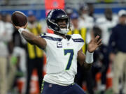 Seattle Seahawks quarterback Geno Smith (7) throws a pass during the first half of an NFL football game against the Detroit Lions, Sunday, Sept. 17, 2023, in Detroit.