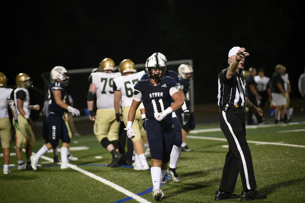 Kaden Hamlin (11) comes off the field after a defensive stop by Skyview in the Storm’s 28-0 win over Jesuit at Kiggins Bowl on Friday, Sept. 1, 2023.