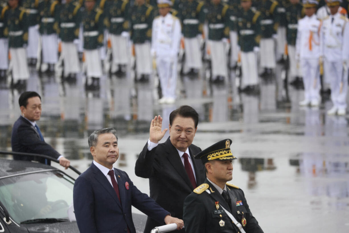 South Korean President Yoon Suk Yeol waves to crowd during a celebration to mark 75th anniversary of Armed Forces Day, in Seongnam, South Korea, Tuesday, Sept. 26, 2023.