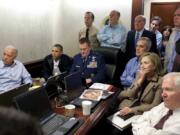 FILE - In this May 1, 2011 file image released by the White House and digitally altered by the source to diffuse the paper in front of Secretary of State Hillary Clinton, President Barack Obama and Vice President Joe Biden, along with members of the national security team, receive an update on the mission against Osama bin Laden in the Situation Room of the White House in Washington.