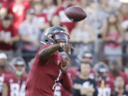 Washington State quarterback Cameron Ward throws a pass during the first half of an NCAA college football game against Wisconsin, Saturday, Sept. 9, 2023, in Pullman, Wash.