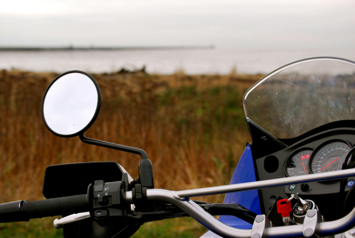 A Kawasaki KLR 650 is trailside and ready to roll.