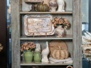 A French country-inspired bookcase takes center stage, offering a picturesque canvas for seasonal delights.