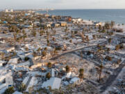 More than two months after Hurricane Ian's landfall, wreckage was abundant. An aerial view shows collapsed mobile homes in Fort Myers Beach on Dec. 4, 2022.