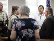 Defendant Jasinto Jimenez, 22, of Wichita Falls, Texas, (second from right) waits to be escorted from the court by bailiffs during a break in his felony murder case, which got underway at the Wichita County Court House on Sept. 26, 2023. Jimenez is charged with the murder of 21-year-old Andres Diaz, who died from fentanyl poisoning in July 2022. He is accused of selling fentanyl-laced pills that killed Diaz.