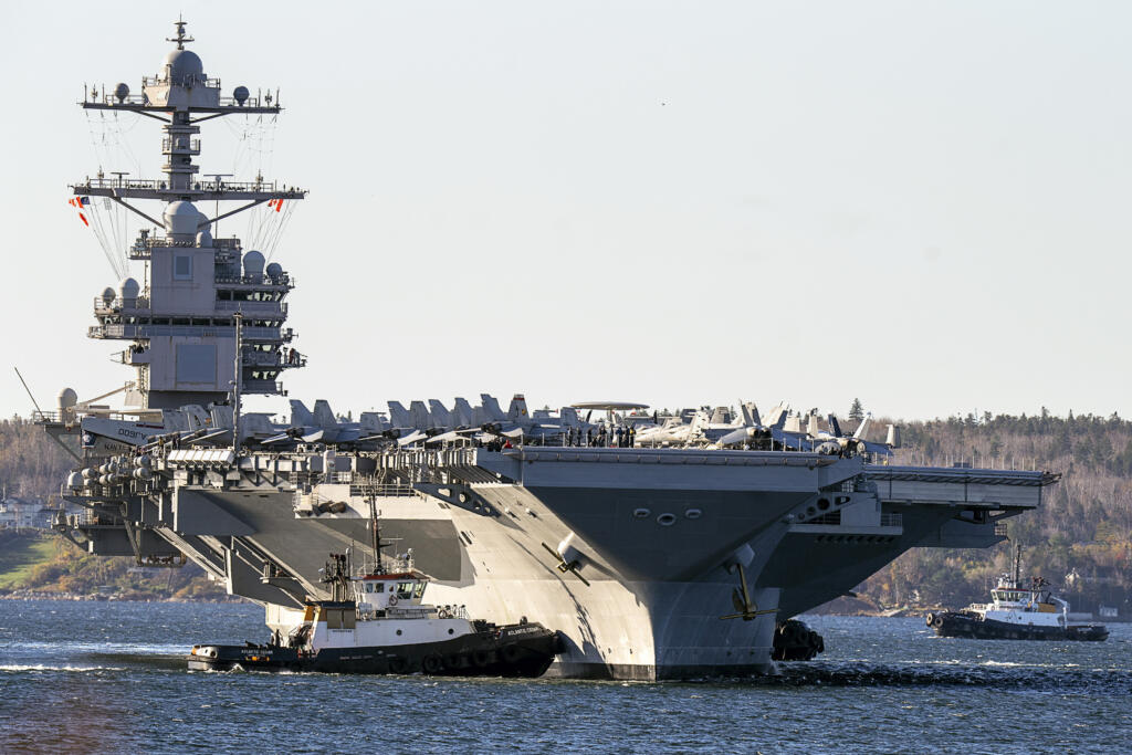 FILE - The USS Gerald R. Ford, one of the world's largest aircraft carriers, arrives in Halifax on Oct. 28, 2022. The Pentagon has ordered the Ford carrier strike group to sail to the Eastern Mediterranean to be ready to assist Israel, two U.S. officials said Sunday, Oct. 8, 2023. The USS Gerald R. Ford and its approximately 5,000 sailors and deck of warplanes will be accompanied by cruisers and destroyers in a show of force that is meant to be ready to respond to anything, from possibly interdicting additional weapons from reaching Hamas and conducting surveillance.