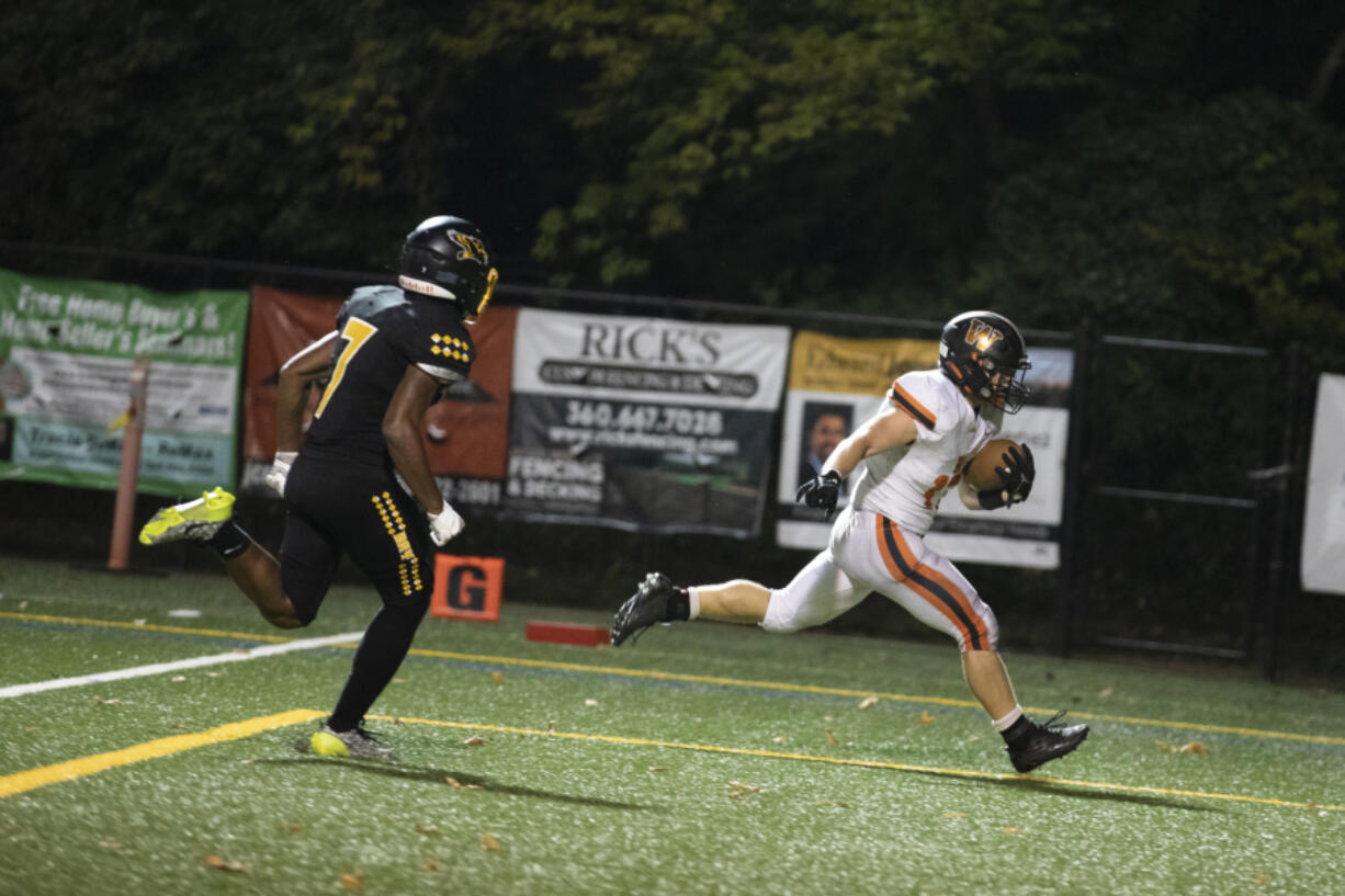 Washougal's Mercy Johnston, right, runs into the end zone for a touchdown against Hudson's Bay at Kiggens Bowl on Friday, Oct. 6, 2023.