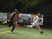 Washougal's Mercy Johnston, right, runs into the end zone for a touchdown against Hudson's Bay at Kiggens Bowl on Friday, Oct. 6, 2023.