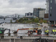 Construction began at the hundred-year-old Terminal 1 dock Tuesday, as work begins to transform it into a public market.