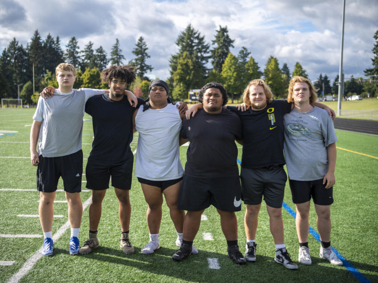 Hudson's Bay's offensive line, featuring tight end Noah David, from left, and linemen Michael Brinson, Tai Telea, Timote Vaea, Jake Hildebrand and Jeremiah Moen, stands for a portrait Tuesday, Oct. 3, 2023, at Hudson's Bay High School. The line has been key in the Eagles 5-0 start to the season.