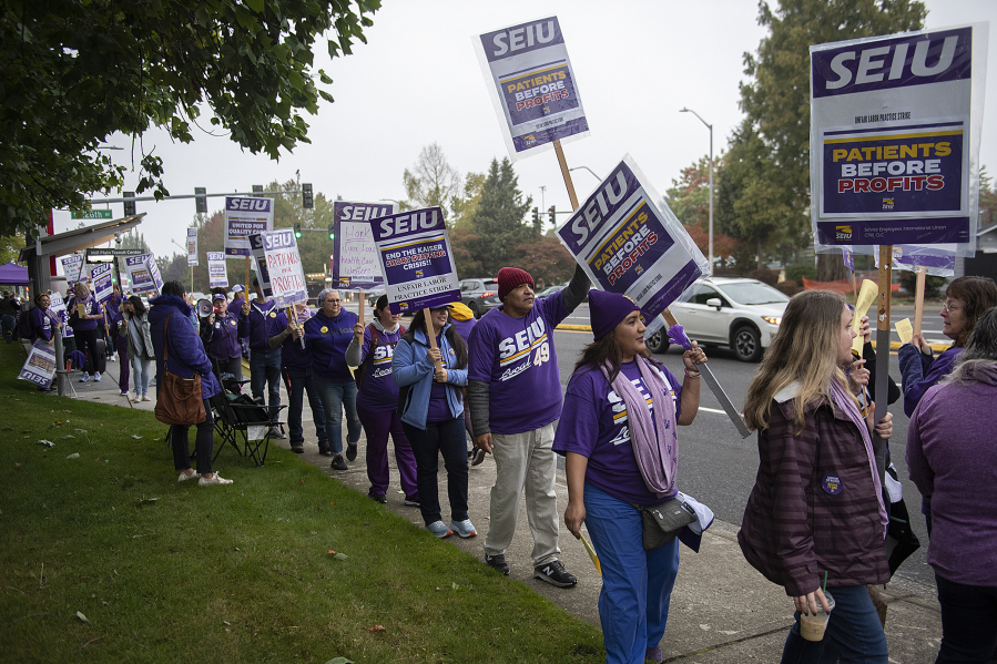 Service Employees International Union Local 49 union members strike outside Kaiser Permanente's Cascade Park Medical Office on Mill Plain Boulevard Wednesday morning.