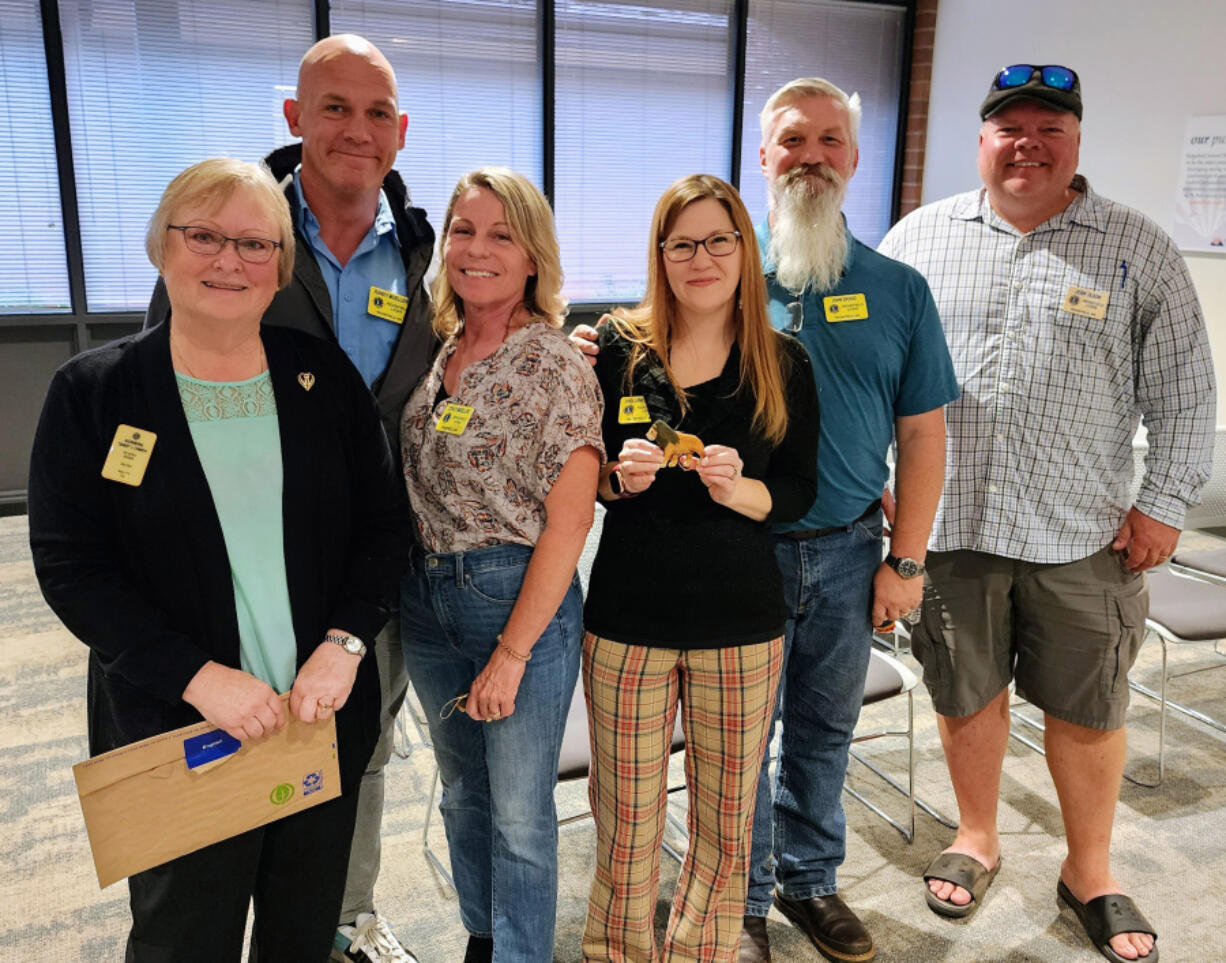 Sandy Conroy, far left, past Lions district governor and Fort Vancouver Lions Club member, inducted four new individuals into the Ridgefield Lions on Sept. 28. They are, left to right: Randy Mueller; Stacy Mueller; Joellene Skoog and John Skoog.