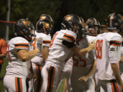 Washougal players celebrate a touchdown against Hudson’s Bay at Kiggens Bowl on Friday, Oct. 6, 2023.