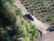 Crews lay down gravel on a new road being built by Portland Vancouver Junction Railroad to service future mining activity in the Chelatchie Bluff mineral lands. Residents in the area are concerned about the impacts the road work and mining will have on the environment.