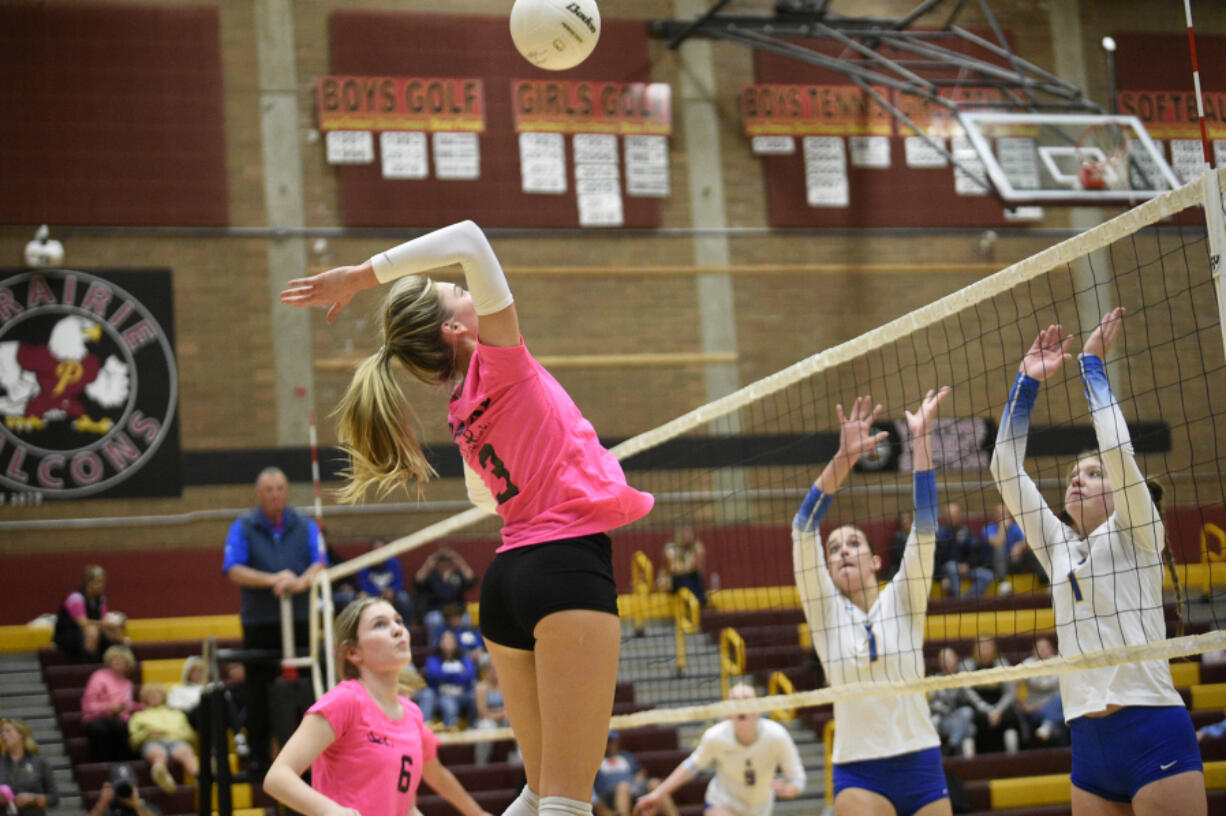 Prairie senior Ali Millspaugh goes for a kill against Kelso in volleyball match at Prairie High School on Monday, Oct. 9, 2023.