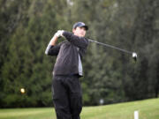 Ryan Wang of Camas hits his tee shot on the No. 11 hole at Heron Lakes Golf Club Great Blue course during a three-player playoff that Wang won at the Class 4A boys golf district tournament on Wednesday, Oct. 11, 2023.