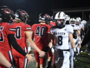 Skyview, right, and Camas players shake hands after the game Friday, Oct. 13, 2023, at Doc Harris Stadium in Camas. Camas won 21-9.