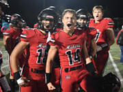 Camas sophomore Alex Hroza, left, and junior Beau Harlan celebrate Friday, Oct. 13, 2023, after the Papermakers’ 21-9 win against Skyview at Doc Harris Stadium in Camas.