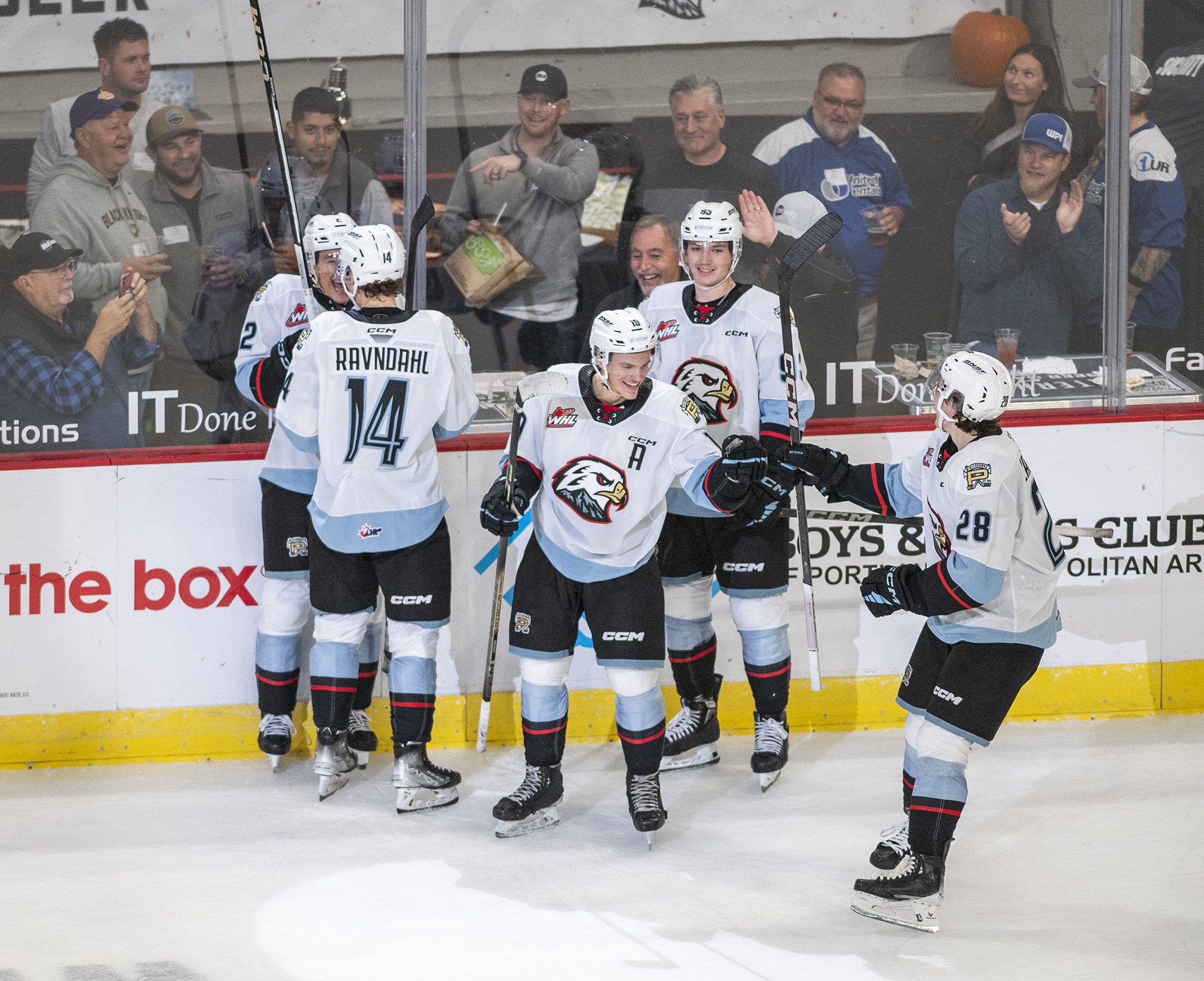 Winterhawks players celebrate with forward Kyle Chyzowski, third from left, after Chyzowski scored his third goal of the game Wednesday, Oct. 18, 2023, during the Winterhawks’ 11-1 win against the Brandon Wheat Kings at Veterans Memorial Coliseum in Portland.