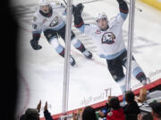 Portland Winterhawks forward Josh Davies, right, celebrates after a goal Wednesday, Oct. 18, 2023, during the Winterhawks’ 11-1 win against the Brandon Wheat Kings at Veterans Memorial Coliseum in Portland.