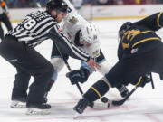 Portland Winterhawks forward Diego Buttazzoni, left, takes a face off against Brandon forward Jayden Wiens on Wednesday, Oct. 18, 2023, during the Winterhawks’ 11-1 win against the Brandon Wheat Kings at Veterans Memorial Coliseum in Portland.