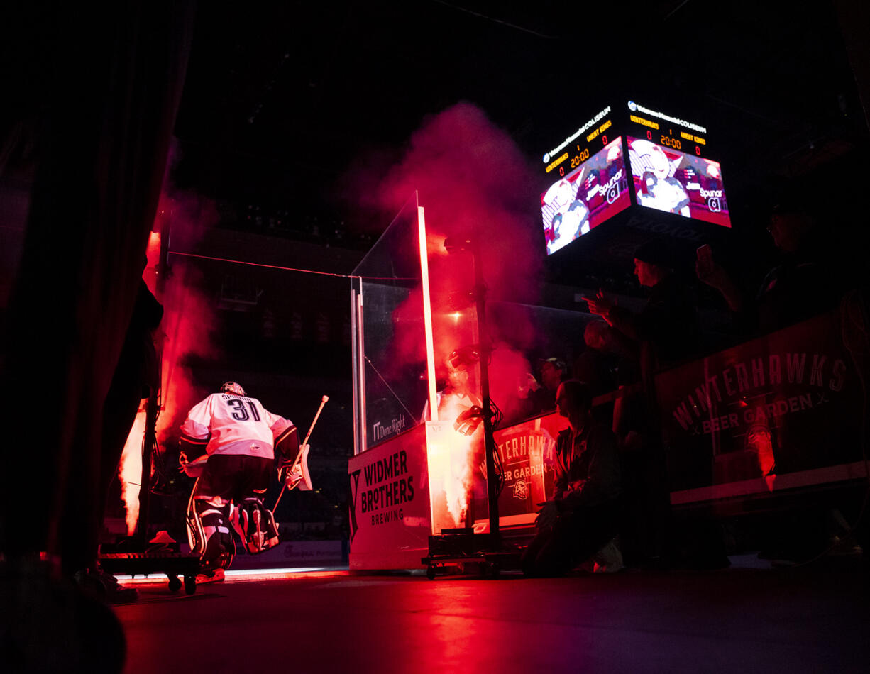 Portland Winterhawks goaltender Jan Špunar, left, skates onto the ice during pregame introductions Wednesday, Oct. 18, 2023, at Veterans Memorial Coliseum in Portland.