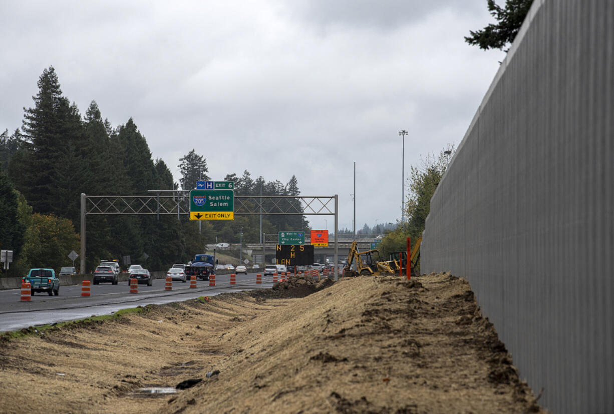 With the cooler temperatures and wetter conditions, work to add a third lane to state Highway 14 is wrapping up for the year and will resume in the spring.