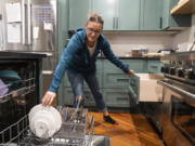 Twin Cities Instagrammer/organizing expert/author Jessica Litman always empties the dishwasher first thing in the morning Sept. 26, in her home in Maple Grove, Minn.