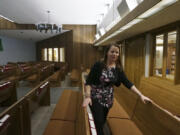 The Rev. Karna Moskalik walks through each line of pews in the sanctuary of Our Savior's Lutheran Church on Sept. 27 in Stillwater, Minn.