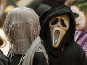 A student dressed as Ghostface from the "Scream" franchise walks in a Halloween costume parade Tuesday at Cape Horn-Skye Elementary School in Washougal.