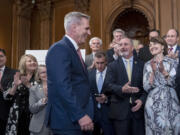 Speaker of the House Kevin McCarthy, R-Calif., is greeted with applause by House Energy and Commerce Committee Chair Cathy McMorris Rodgers, R-Wash., far right, and Rep. Jeff Duncan, R-S.C., chairman of the Energy, Climate, and Grid Security Subcommittee, second from right, after passing a energy package that would counter virtually all of President Joe Biden's agenda to address climate change, at the Capitol in Washington, Thursday, March 30, 2023. The bill now goes to the Senate.  (AP Photo/J.
