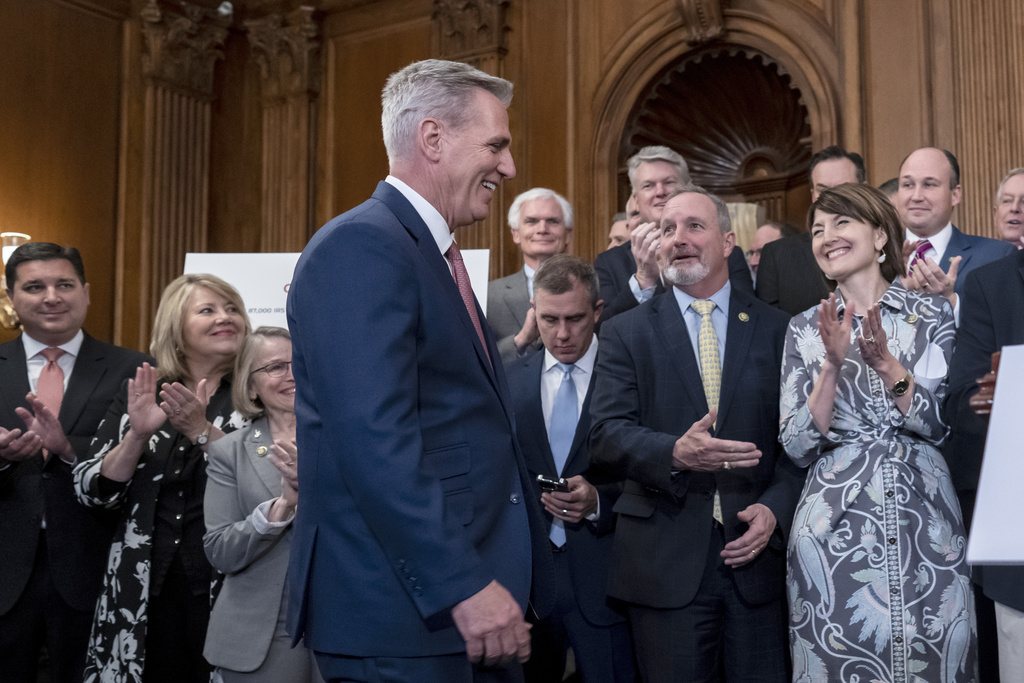 Speaker of the House Kevin McCarthy, R-Calif., is greeted with applause by House Energy and Commerce Committee Chair Cathy McMorris Rodgers, R-Wash., far right, and Rep. Jeff Duncan, R-S.C., chairman of the Energy, Climate, and Grid Security Subcommittee, second from right, after passing a energy package that would counter virtually all of President Joe Biden's agenda to address climate change, at the Capitol in Washington, Thursday, March 30, 2023. The bill now goes to the Senate.  (AP Photo/J.