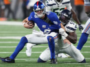 New York Giants quarterback Daniel Jones (8) is sacked by Seattle Seahawks linebacker Boye Mafe (53) during the fourth quarter of an NFL football game, Monday, Oct. 2, 2023, in East Rutherford, N.J.