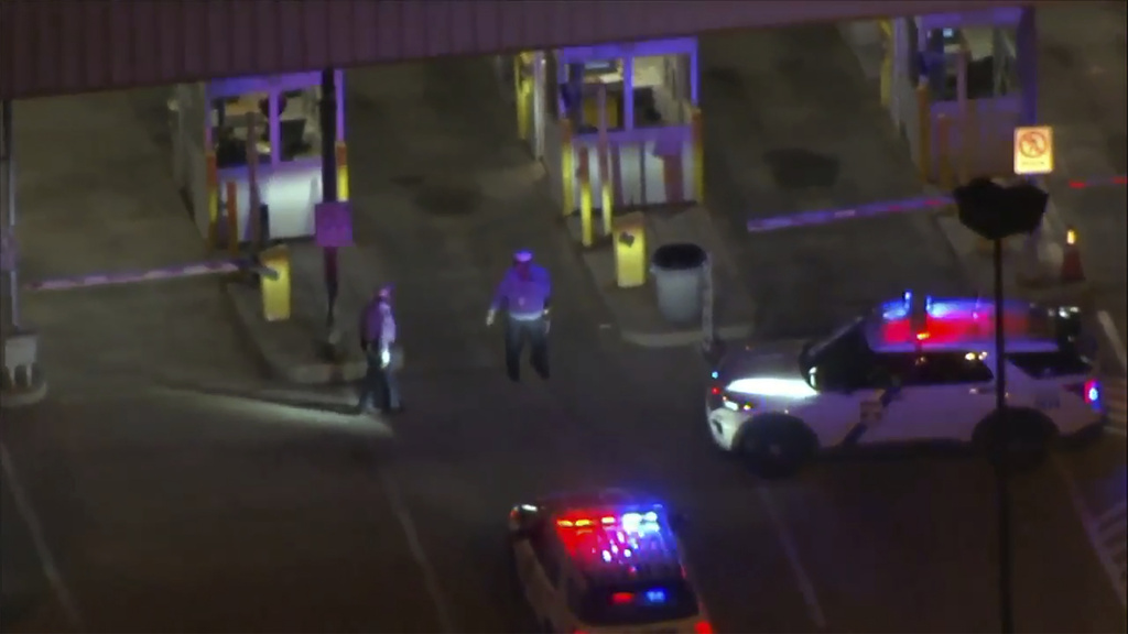 This aerial image made from video provided by WPVI TV shows police cars and officers around a Philadelphia International Airport parking garage, in Philadelphia, PA., on Oct. 12, 2023.